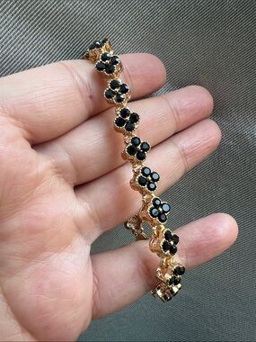 Gold Floral Bracelet with Black Enamel Accents
